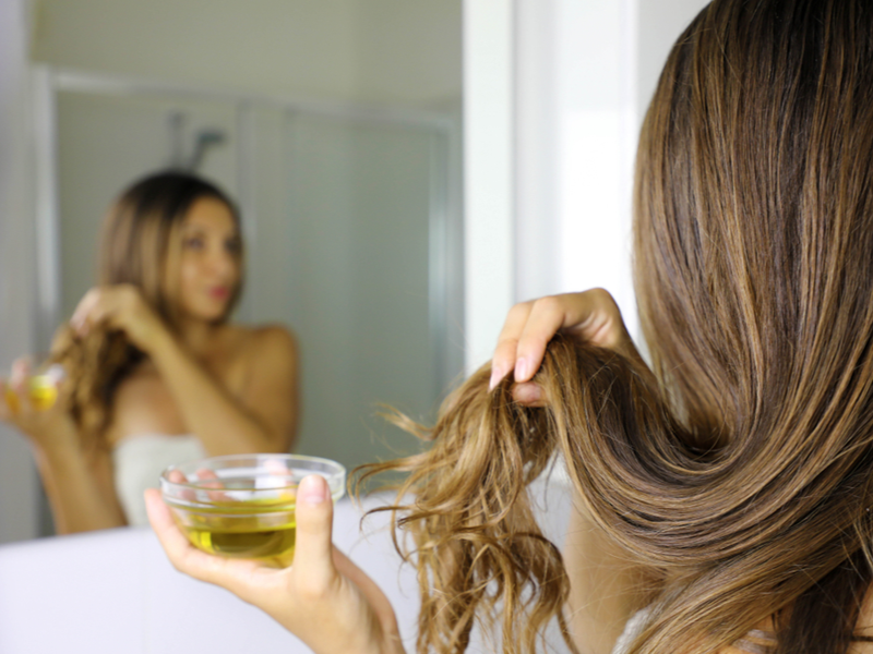 Woman using castor oil for hair