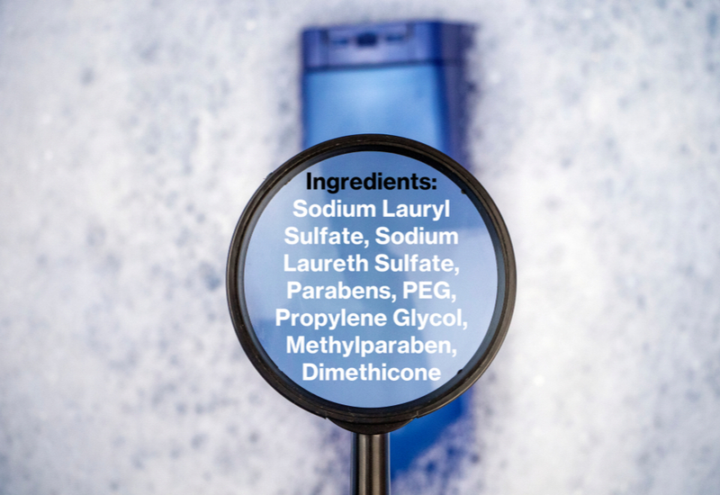 Label in a magnifying glass for a piece on what ingredients in shampoo to avoid