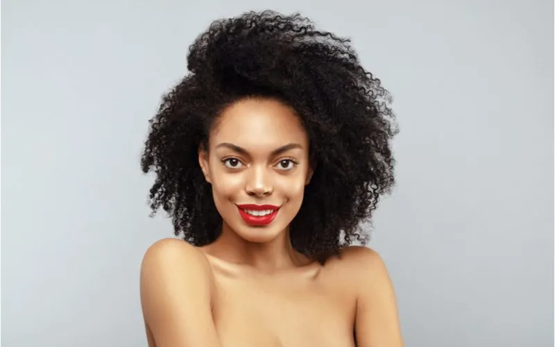 Woman with thick hair in an image to accompany an is my hair thick or thin quiz