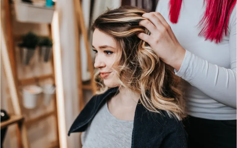 Woman with hair highlights for a piece on highlights vs single-process hair color