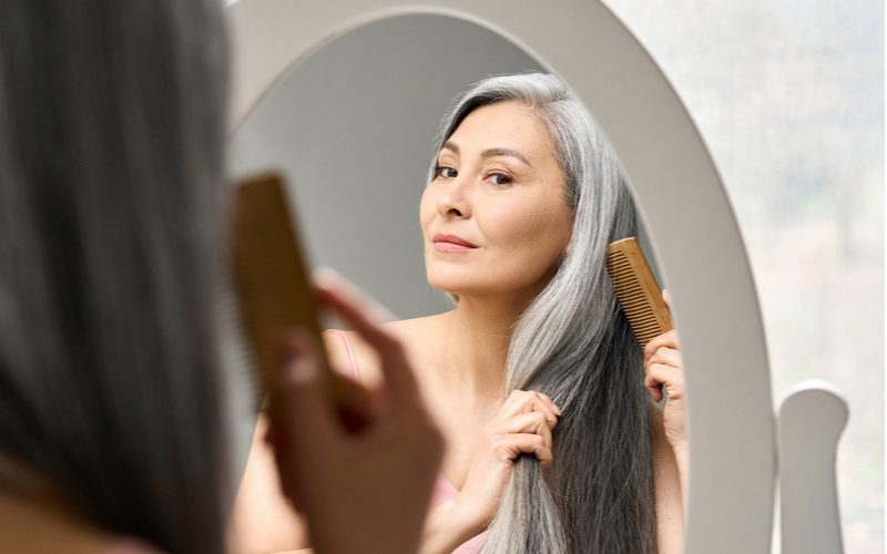 Woman with lowlights transitioning to gray hair naturally
