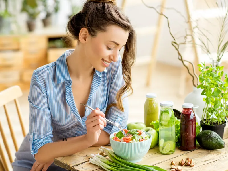 Woman eating a healthy diet to thicken her hair naturally