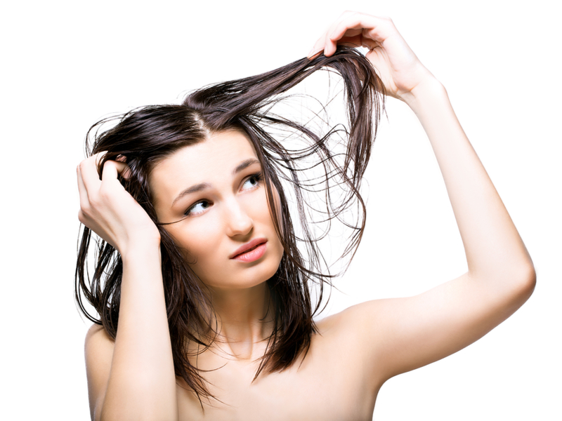 Woman holding her hair and wondering what EDTA is in shampoo
