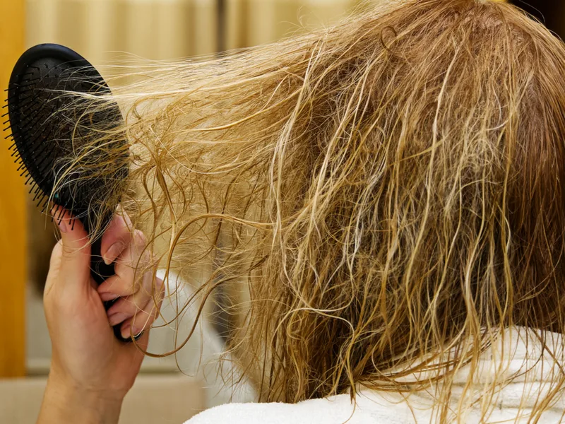 Woman who needs the best shampoo for permed hair