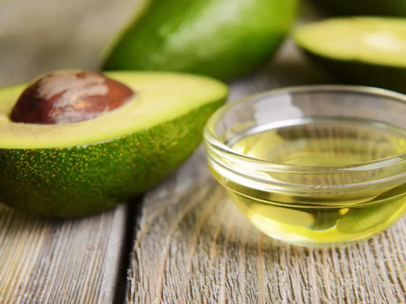 Image of avocado oil for low porosity hair on a table