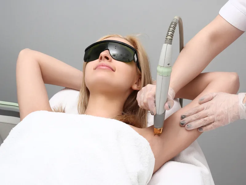 Woman wondering, "should I get laser hair removal" and then answering the question by doing it