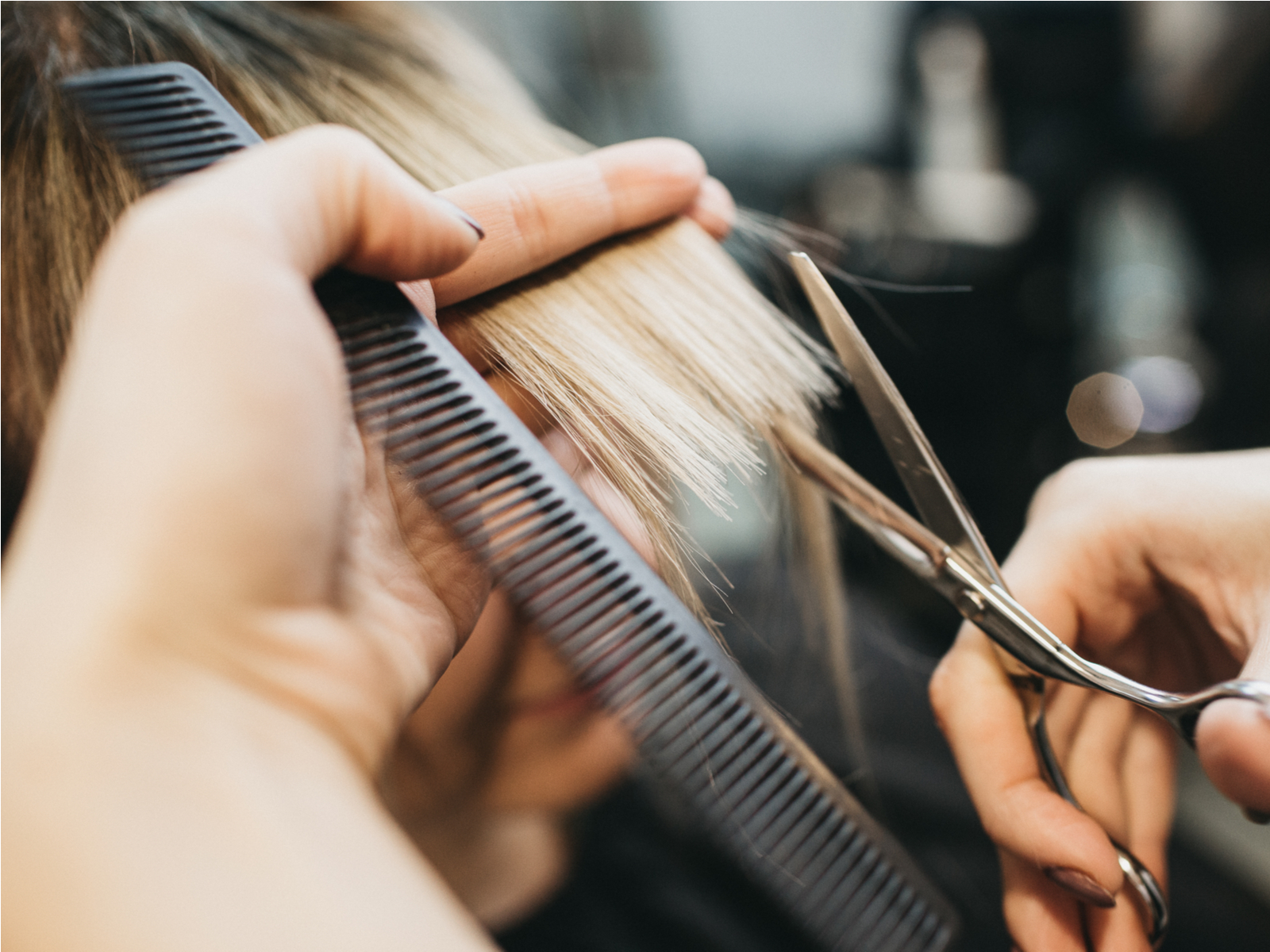 Woman wondering should I get my hair thinned at the salon