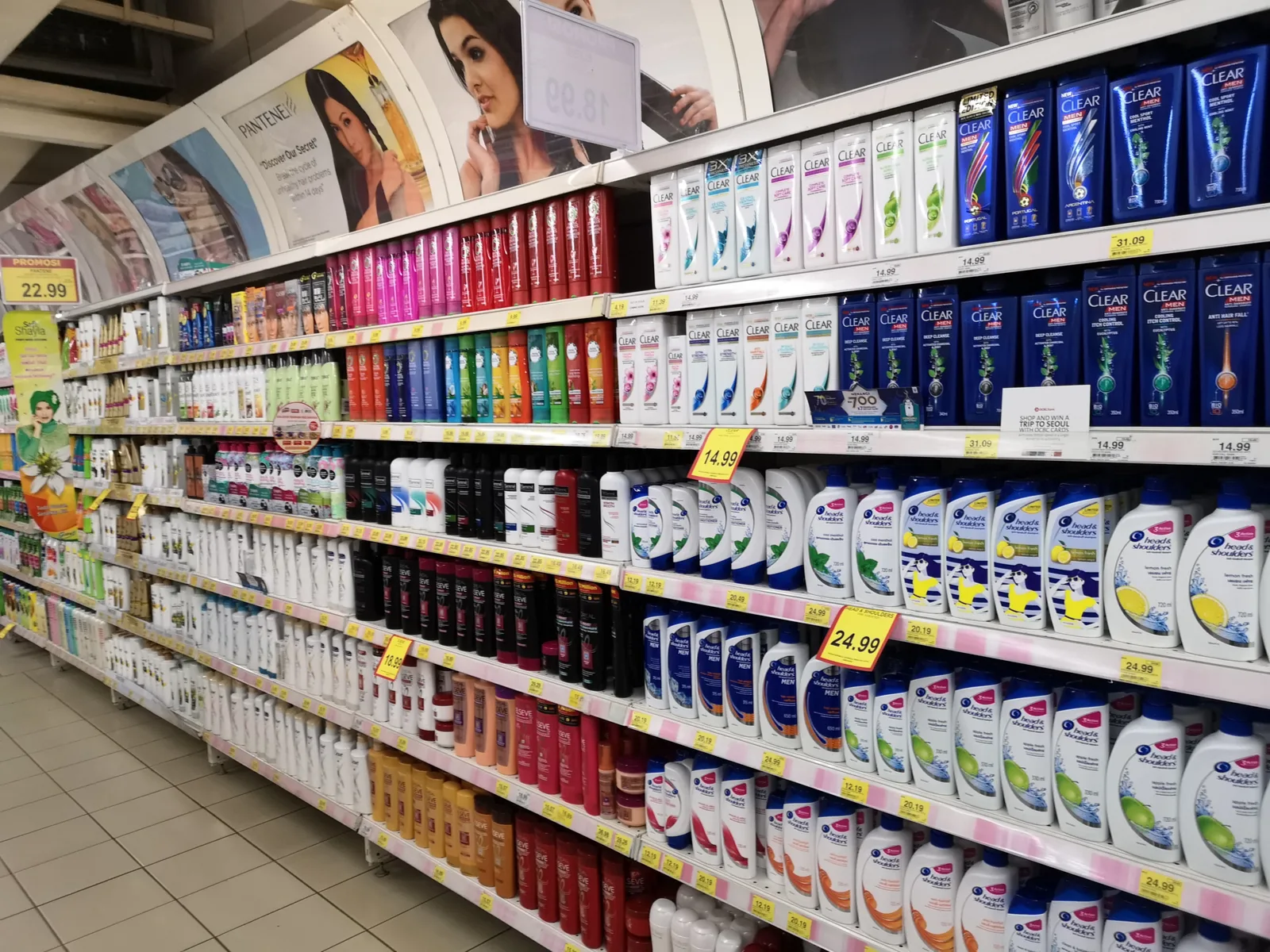 Various shelves holding the best drugstore shampoos in huge quantities