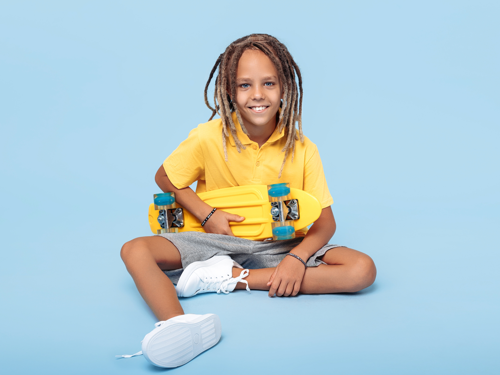 Ombre Dreadlocks pictured on a young kid for a piece on long hairstyles for boys