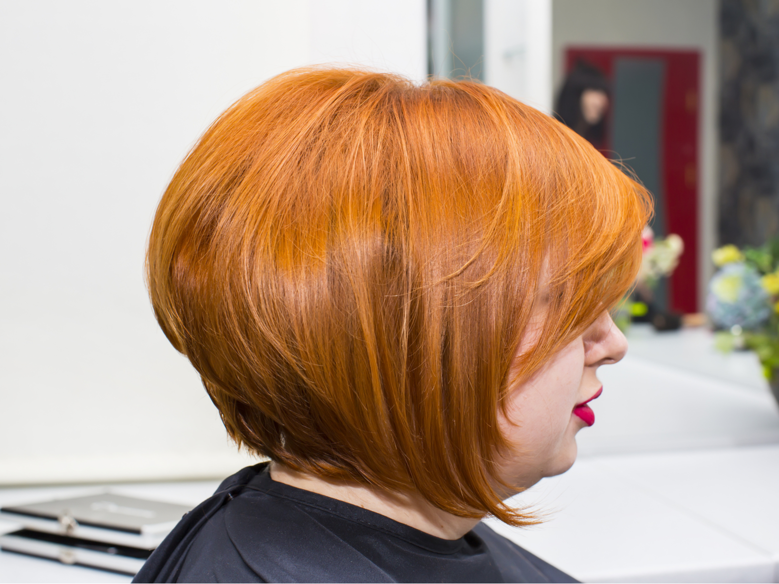 Inverted Bob With Crown Volume and Side-Swept Bangs, one of the best haircuts for fat faces