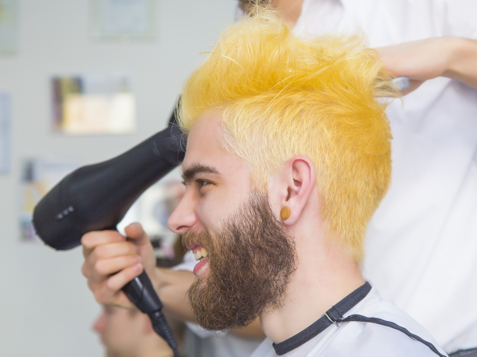 Ombre Lemony Yellow men's hair color on a guy in a salon