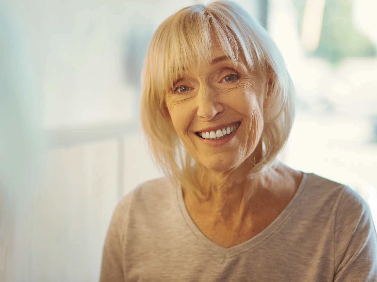 Razored Bob With Bangs and Face-Framing Layers, a great hairstyle for women over 70
