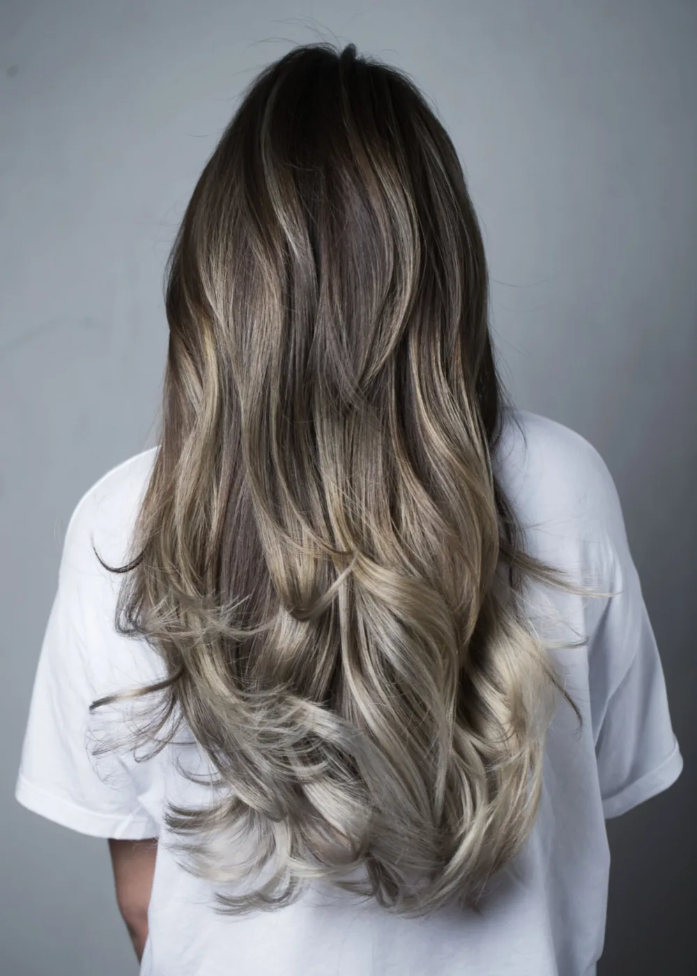 Silvery Ash Blonde and Brown Balayage for a piece on cool tone hair colors