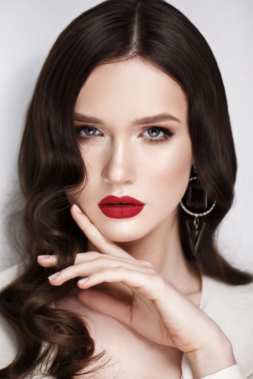 Cool Mocha Brown, one of the best hair colors for pale skin, on a woman with red lips