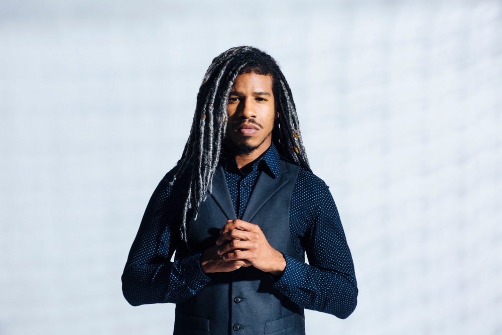 Gray The New Way faux locs on a man in a button-up shirt