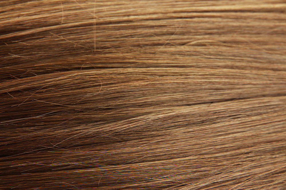 Shiny chestnut brown hair close-up background