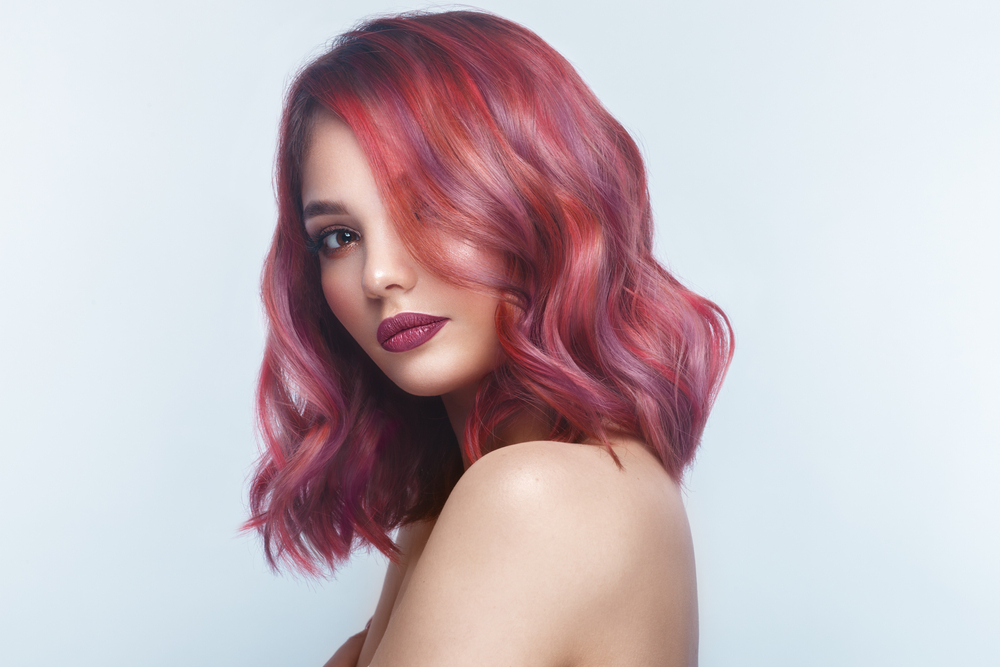 A multi-colored hair idea featuring a woman with Ruby and Amethyst locks