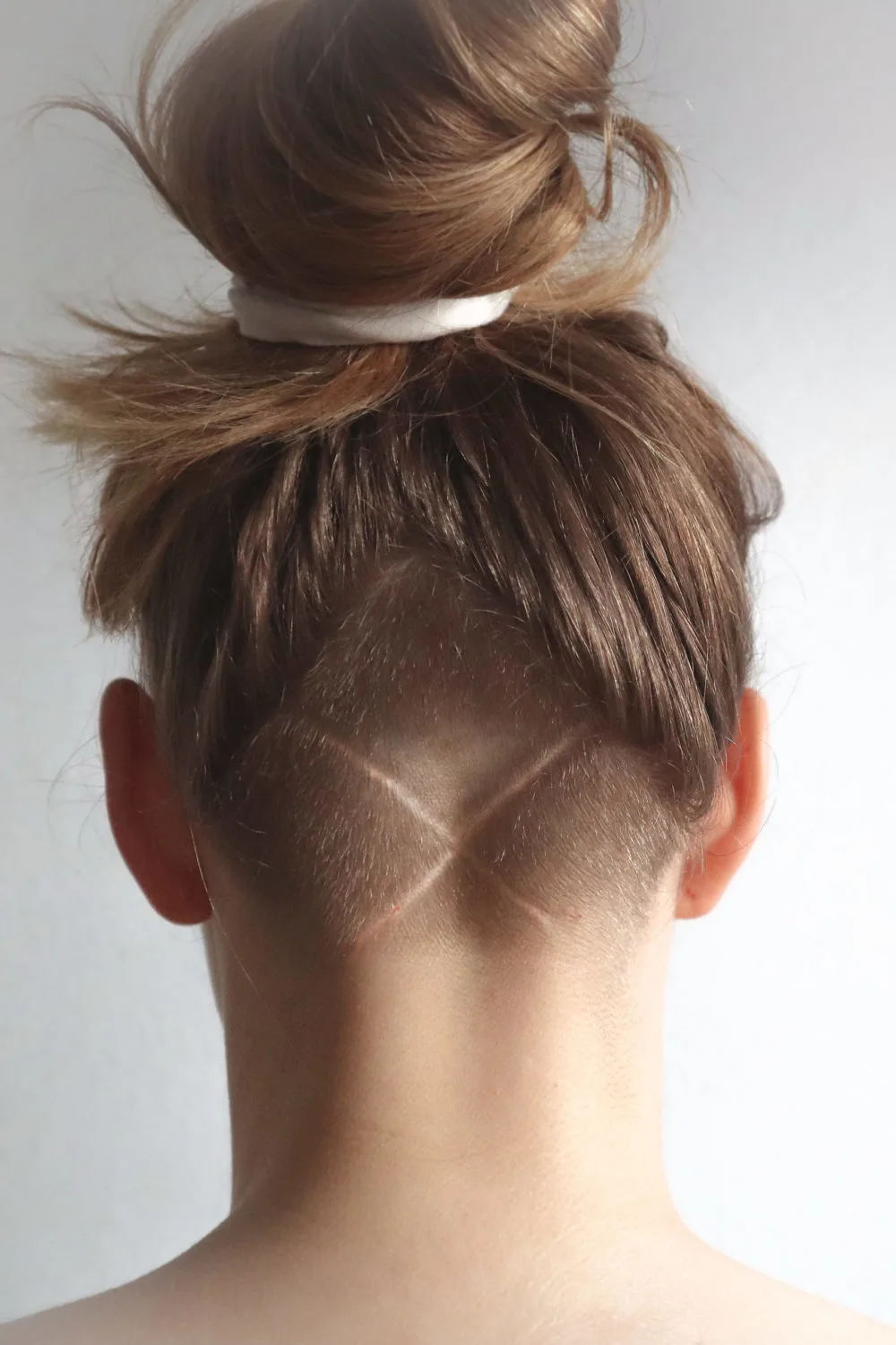 Woman showing us How to Grow Out a Nape Undercut