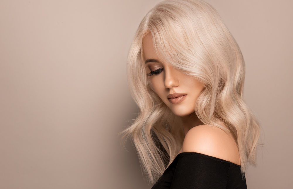 Woman with Prismatic Platinum Blonde hair, one of the best hair colors for olive skin