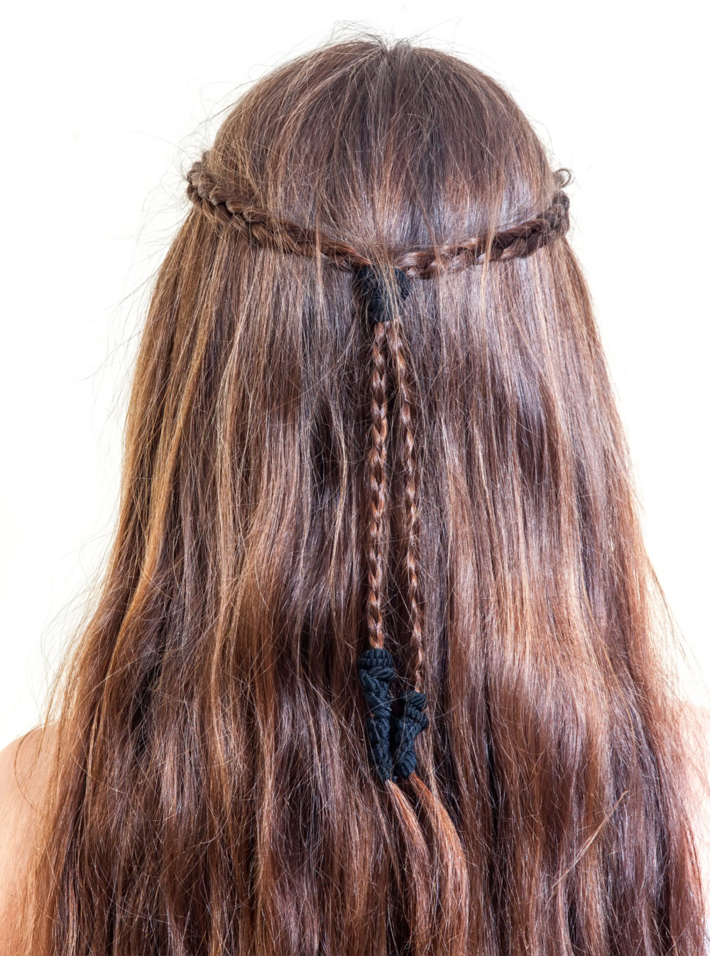 Half-Up Braids, a great y2k hairstyle, on a woman in a studio turned away from the camera