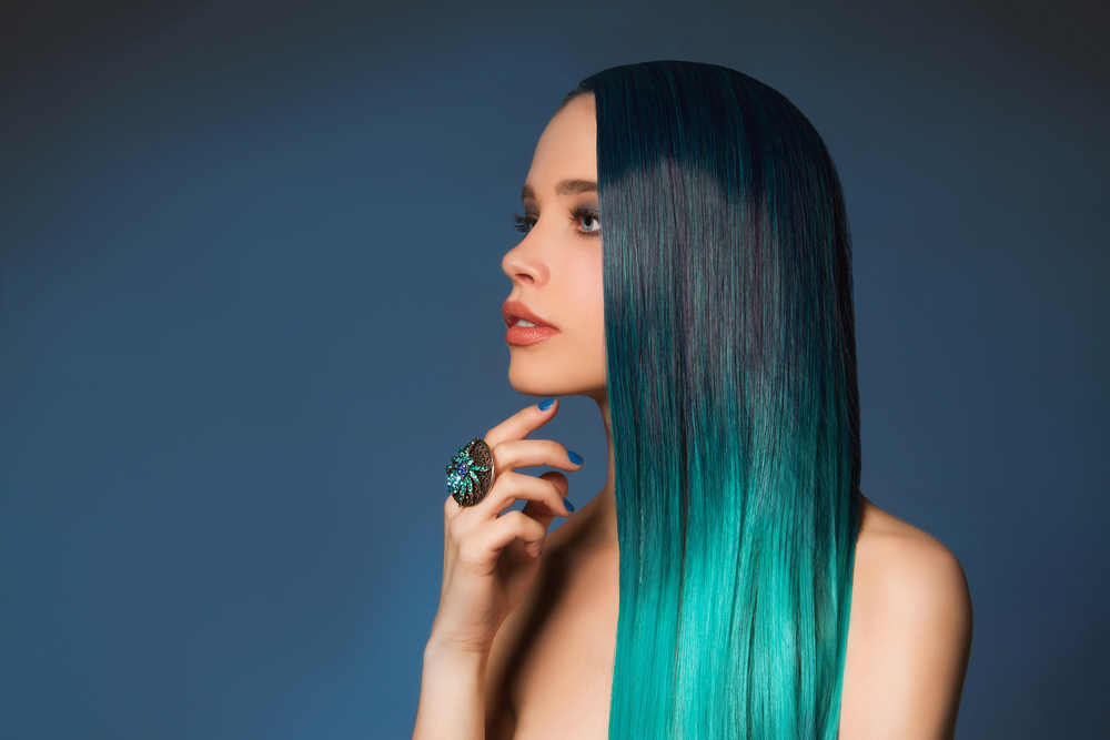 Deep Peacock Teal to Aquamarine Ombre, a great unnatural hair color for blue eyes, on a woman with olive skin