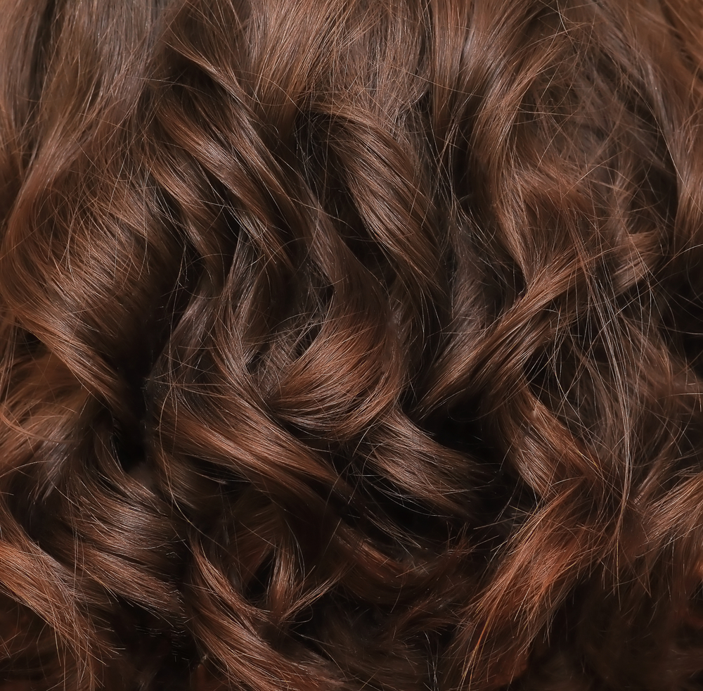 Beautiful brown chestnut colored hair on a square background