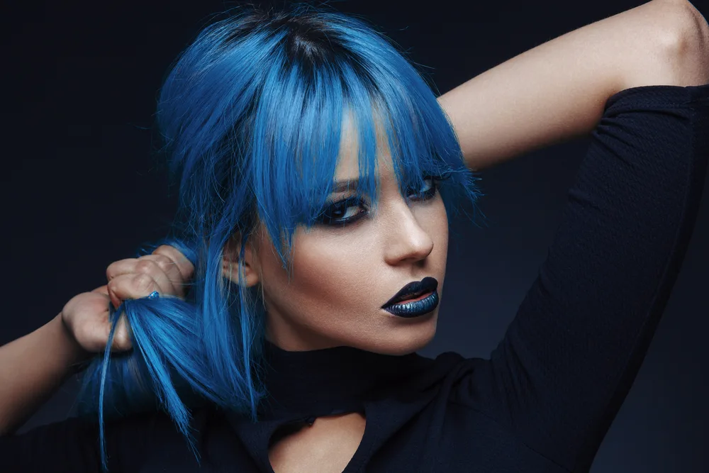 Woman with blue hair for a piece on unnatural hair colors for cool skin tones