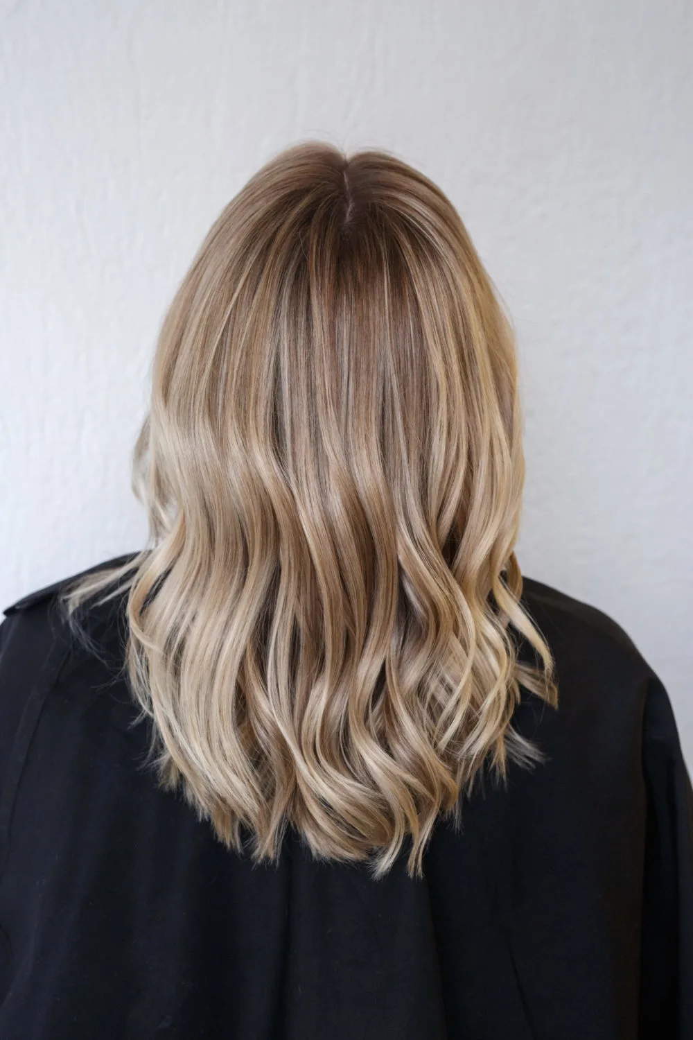 Dimensional Blonde Balayage With Warm Chestnut Root Smudge