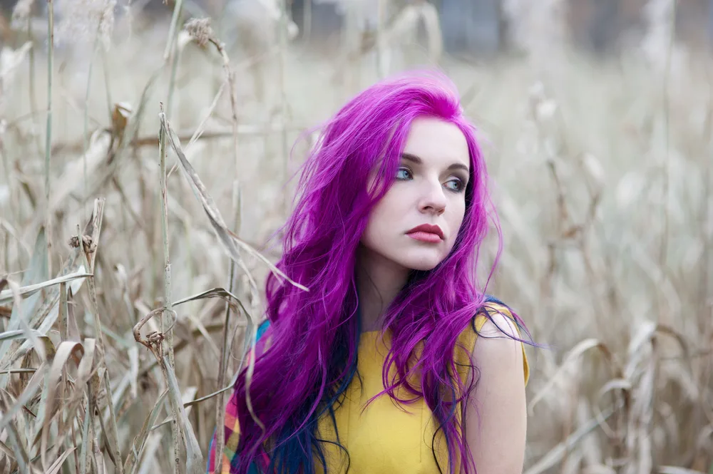 Woman with purple hair wondering what does purple hair look like when it fades