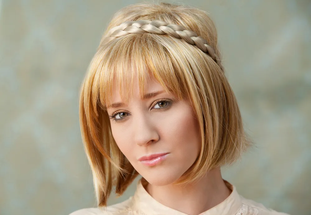 For a piece on the best braids for short hair, pictured is a woman with a Chic Braid Headband