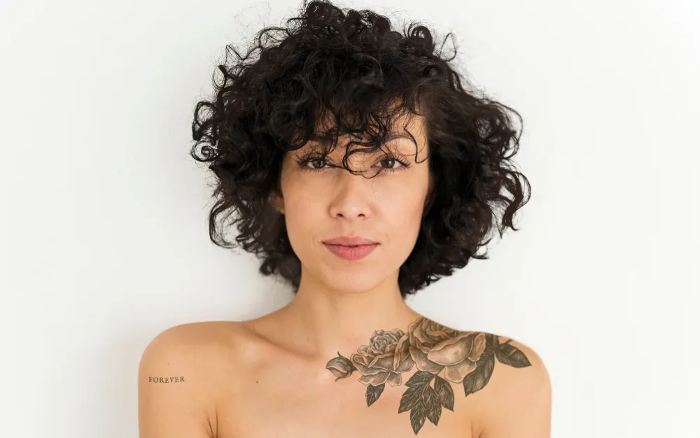 Tapered Bob With Curly Side Bangs, a great mixed race hairstyle for curly hair