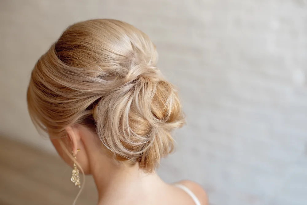 Low Chignon With Boosted Crown Volume for a piece on mother of the bride hairstyles