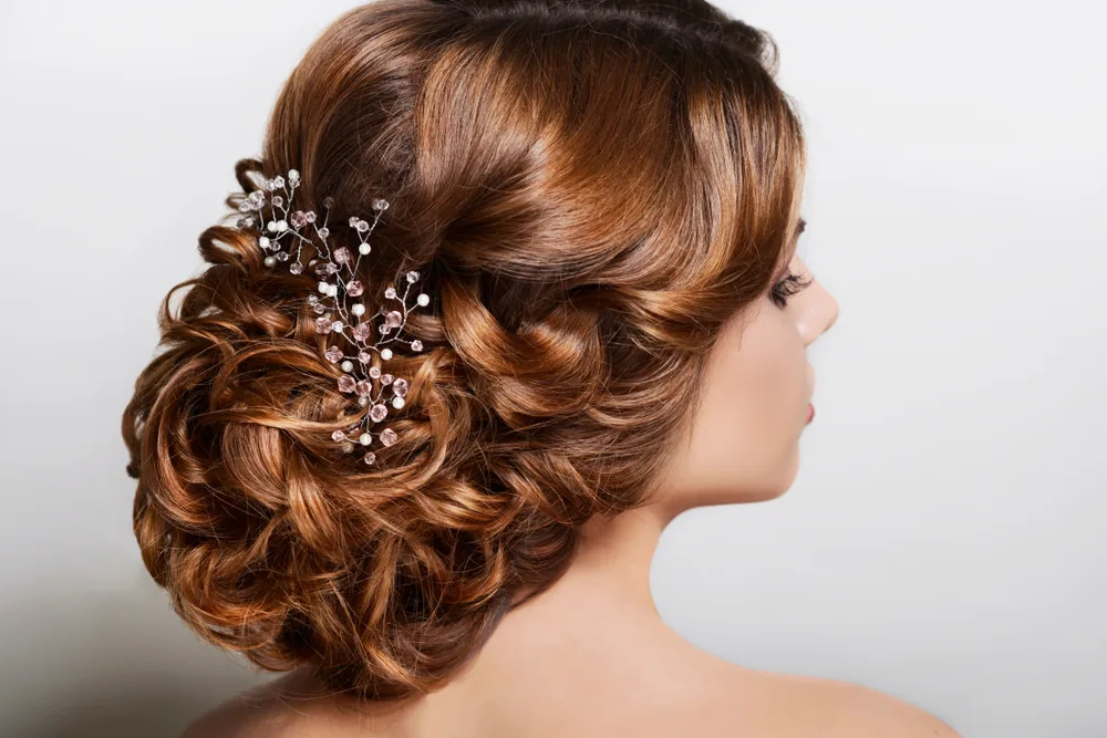 Low and Voluminous Curly Updo, a great prom hairstyle for this year