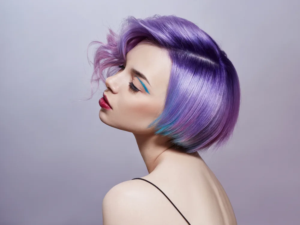 For a piece on blue and purple hair ideas, a woman with shades of Purple With Blue Accents