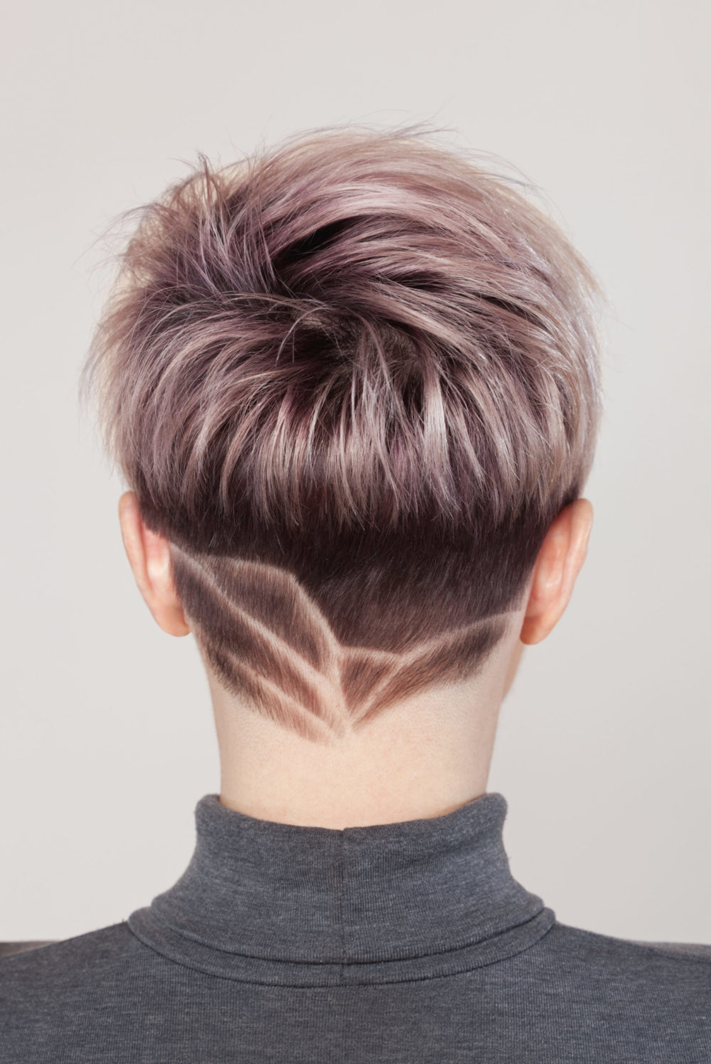 Tapered Crop With Shaved Design as a women's tapered hairstyle