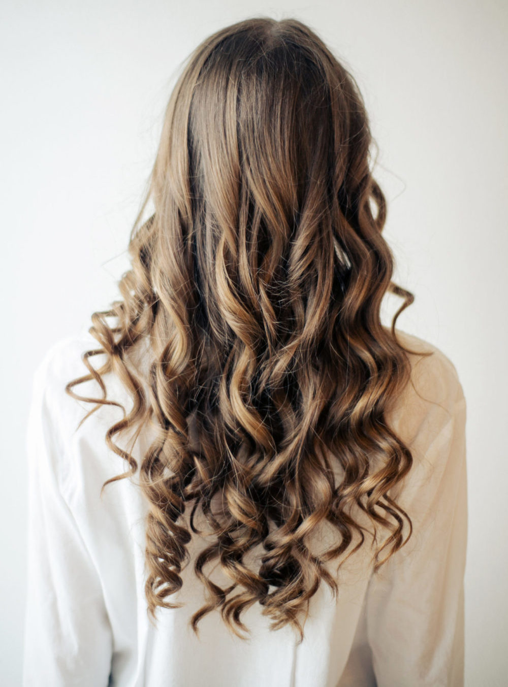 For an idea for brown hair highlights, a woman with Mocha With Subtle Light Golden Brown Highlights