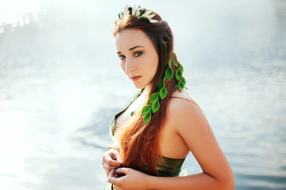 Woman with sea weed in her hair in a mermaid costume