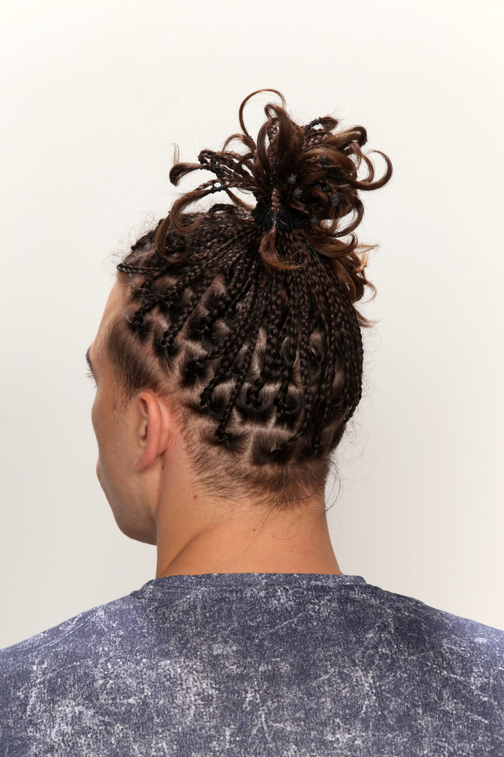 Box Braids With Messy Man Bun for a roundup of the best white mens braided hairstyles