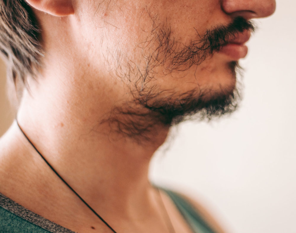 Image of a man with a patchy beard for a piece on how long does it take to grow a beard