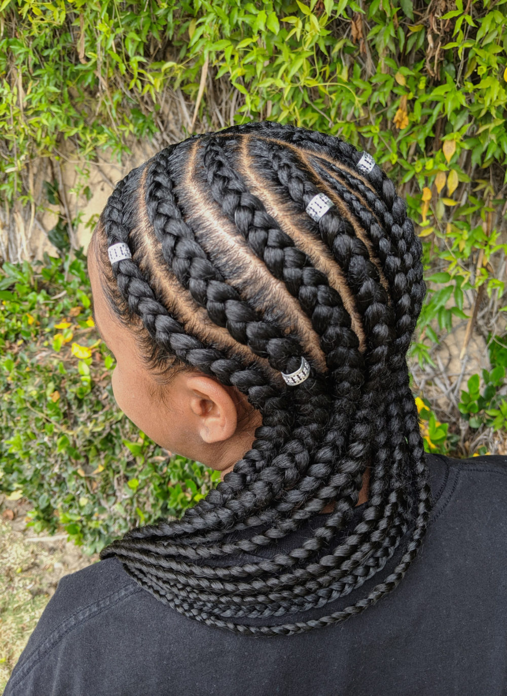 Downward-Curving Feed-In Cornrow Braids With Cuffs