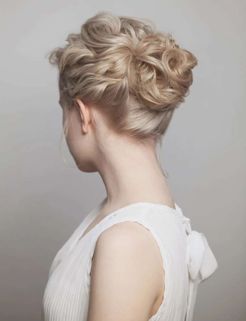 Tousled Pinned Wavy Bun, one of the best mother of the bride hairstyles