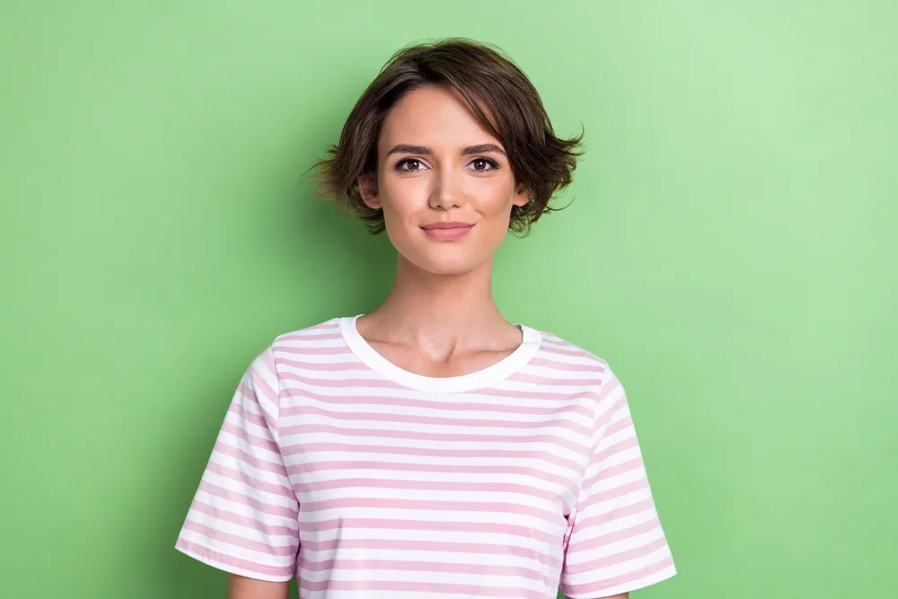 For a piece on short layered hair, a woman wears Tapered Bob With Flipped Layers