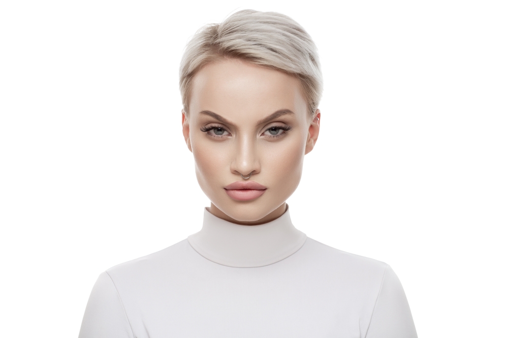 Woman wearing a Tapered Pixie With Side Part, a favorite short hairstyle for women with square faces