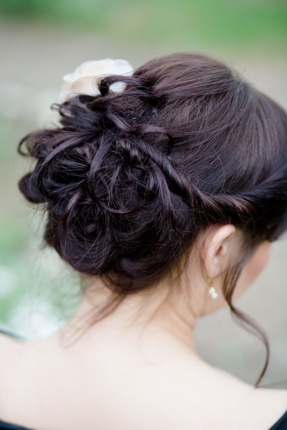 Curly Twist-Back Mid Bun, a fantastic mother of the bride hairstyle