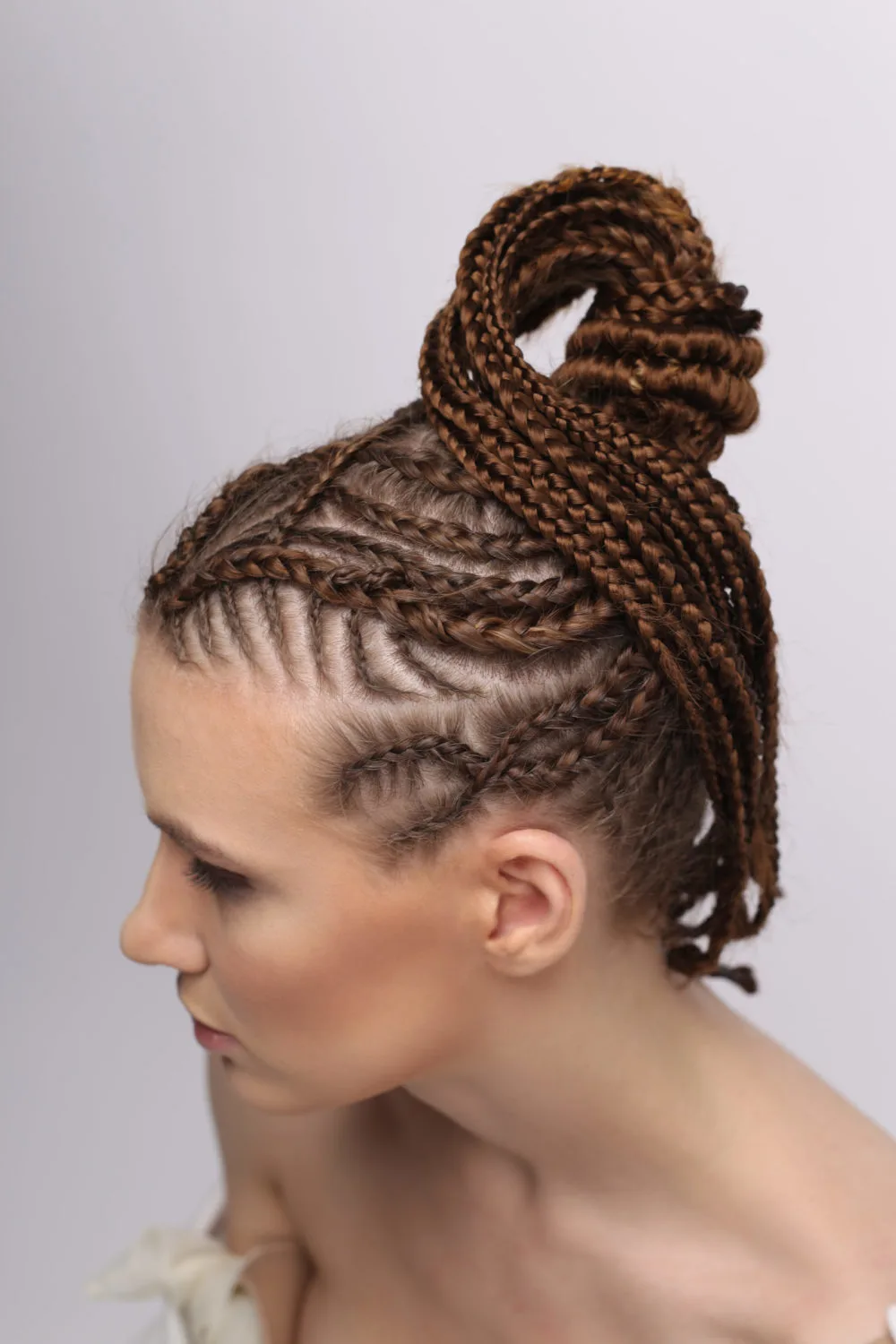 Intricate Cross-Over Cornrow Braids With High Ponytail