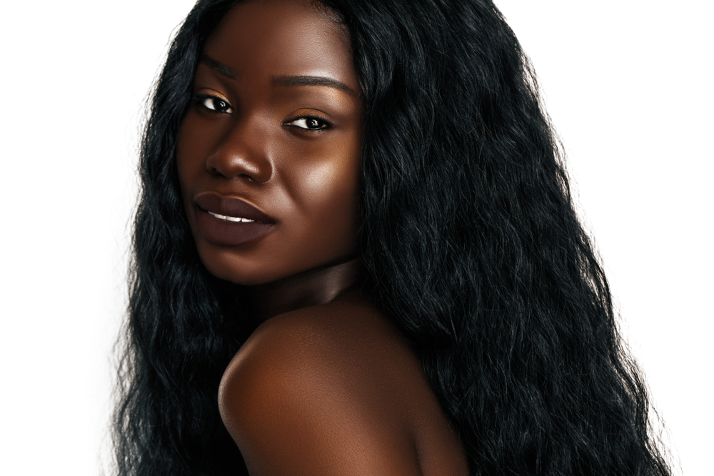 Pure Ebony hair color on a woman with dark skin in a studio