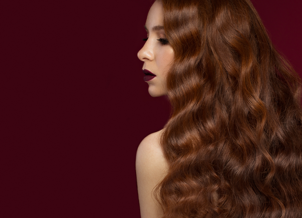 Roundup of the best hair colors for red hair featuring a woman with Medium Chestnut