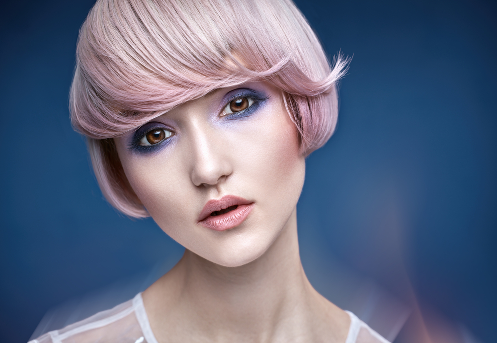 Barely-There Silk Pink hair as a featured light pink hairstyle with light pink lipstick in a blue room