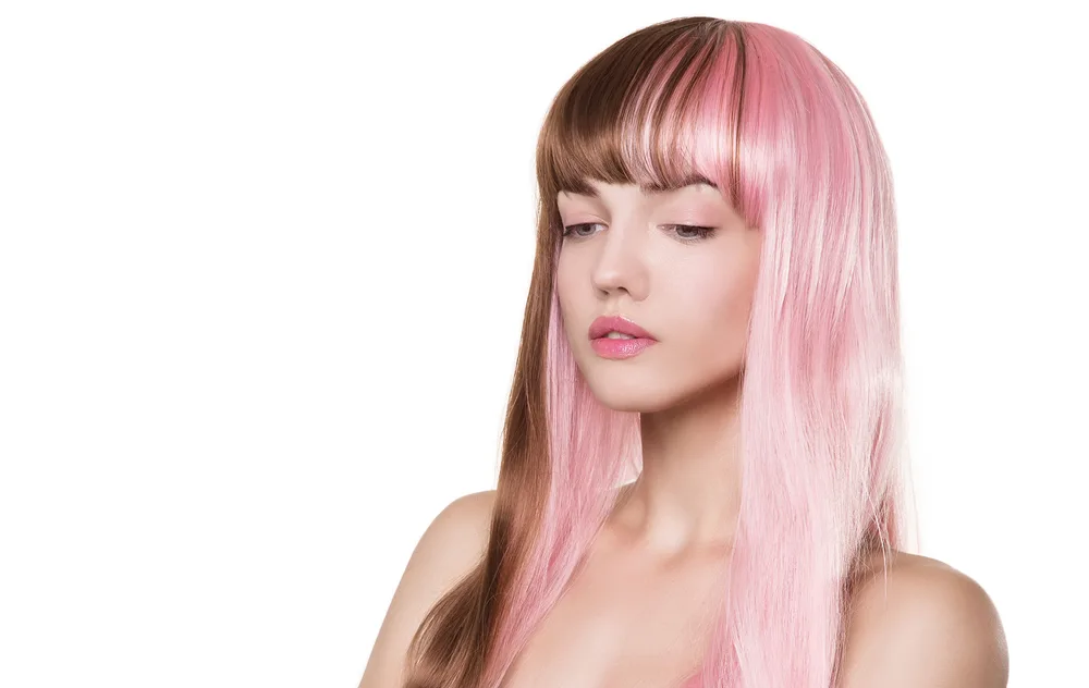 Baby Pink and Chestnut Split Dye hair color idea in a half-and-half mixed style