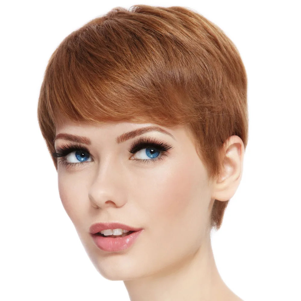 Redheaded woman with short hair wears a clean casual hairstyle for a piece on styling short pixie cuts